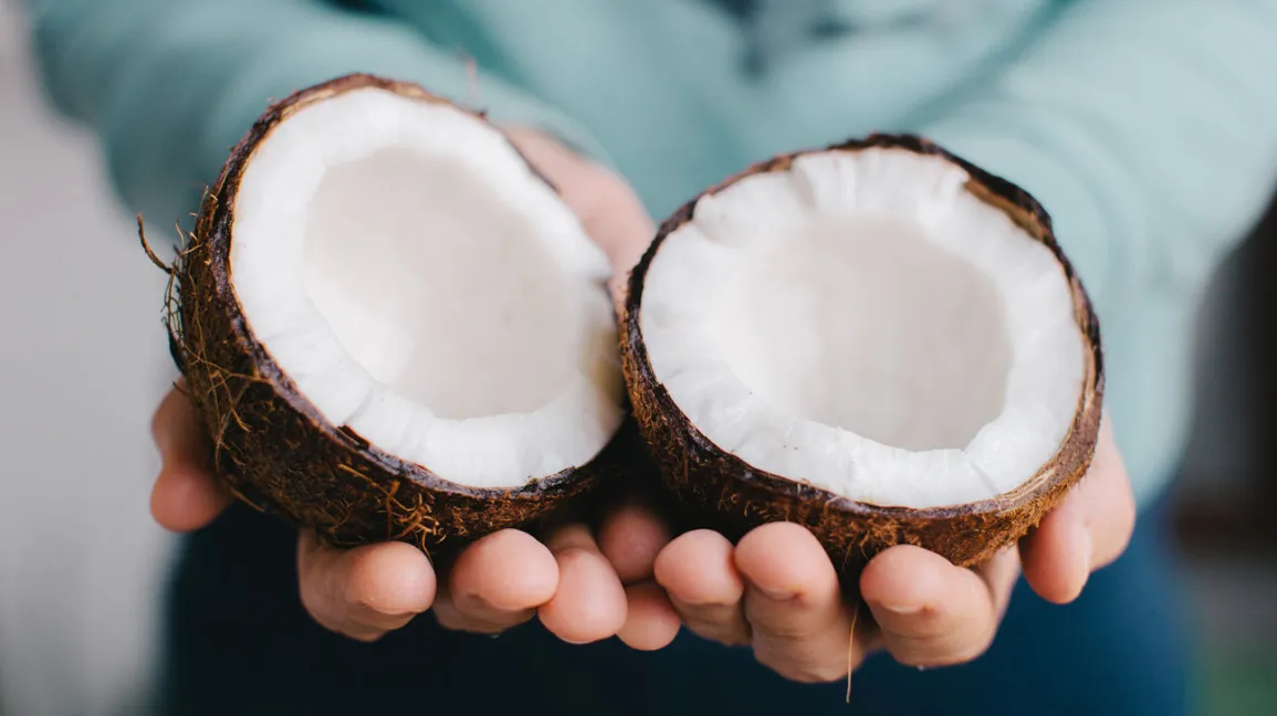coconut-holding-fruit-1296x728-header-1296x728